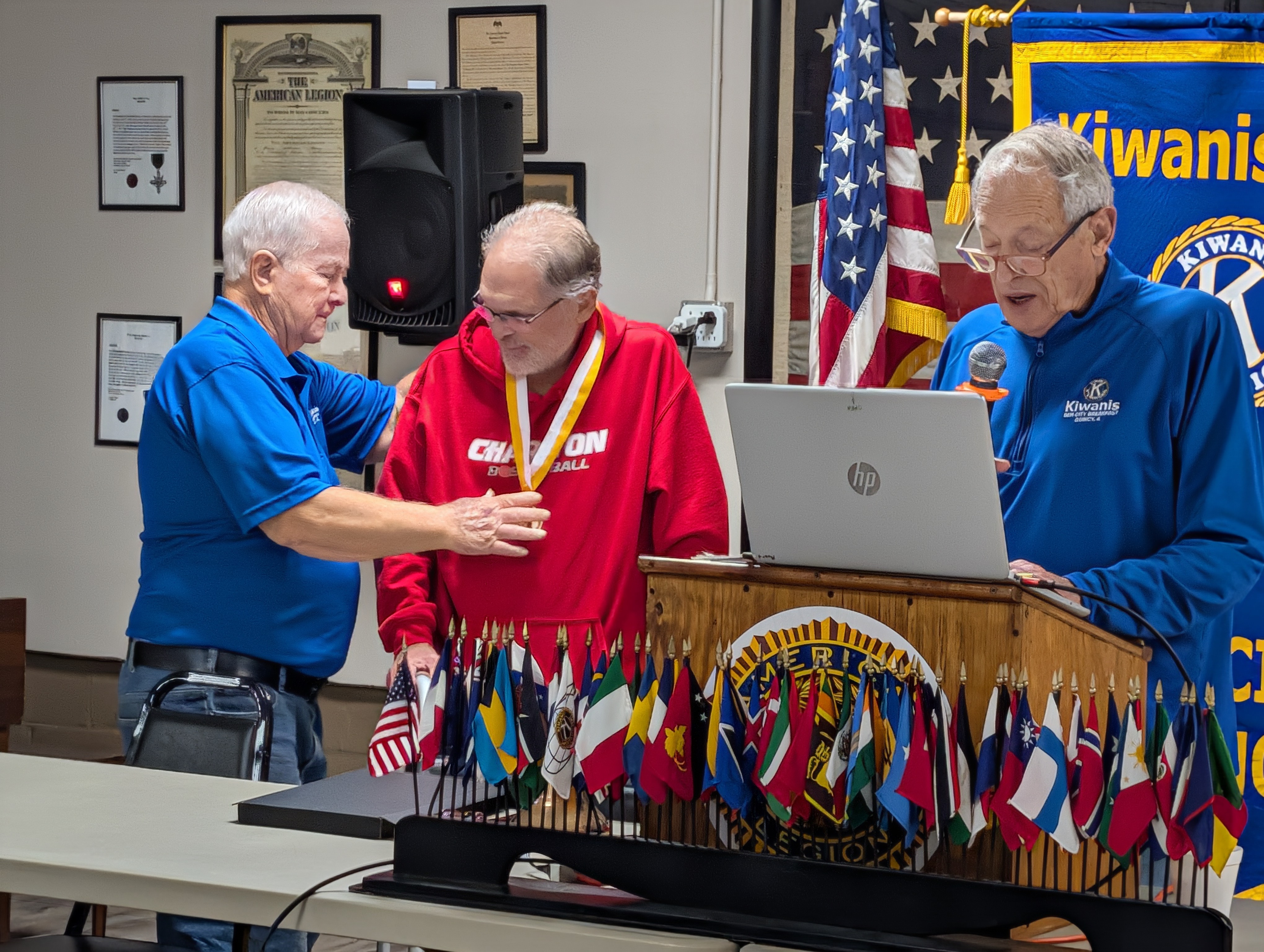 Pat Bauer receiving the Dr. Luis V. Amador Medallion at a Gem City Kiwanis meeting