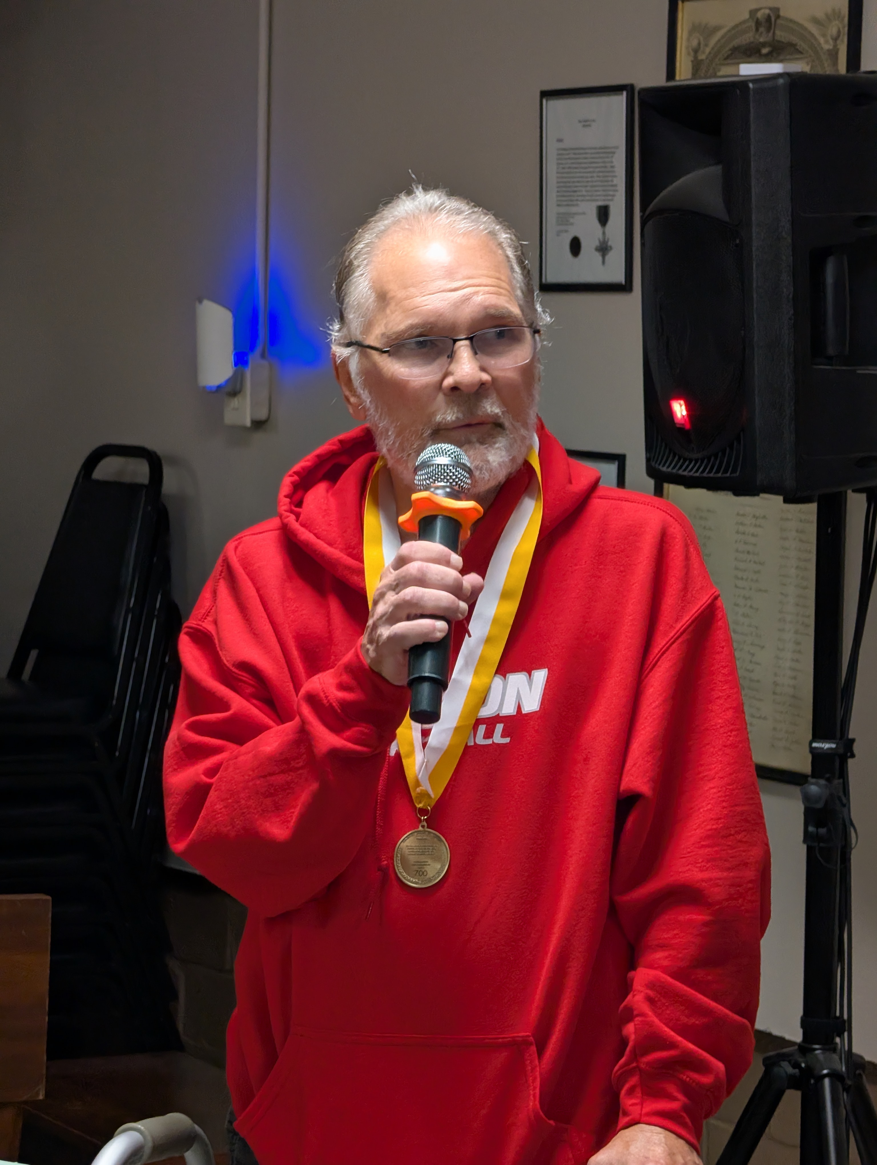 Pat Bauer speaking while wearing the Dr. Luis V. Amador Medallion
